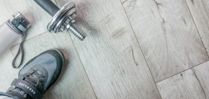 Fitness objects isolated on wooden background. Gray Sneakers, dumbbells and water bottle. Active, healthy lifestyle, sport, fitness, and objects concept. More of my photos and videos Adobe Stock:http://bit.ly/3RqlciK More of my photos and videos Shutterstock: https://www.shutterstock.com/g/ALEKSANDRBERDYUGIN My email: bermix999@gmail.com